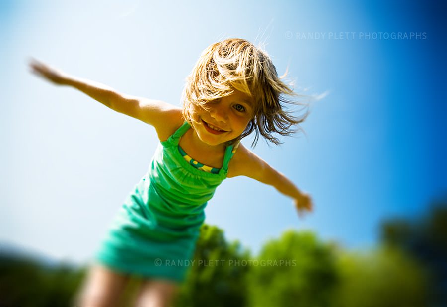 Cute little girl with her arms spread